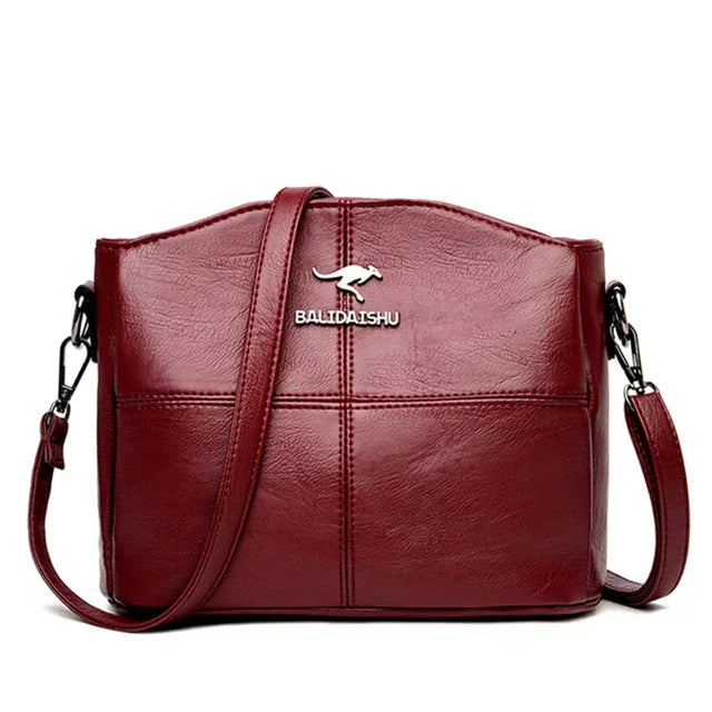 Elegante bolso tote y bandolera de piel bordada para mujer