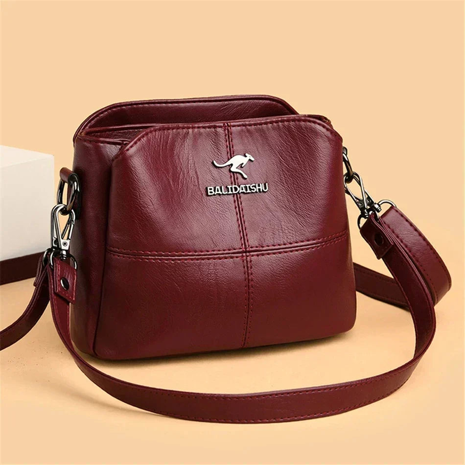 Elegante bolso tote y bandolera de piel bordada para mujer