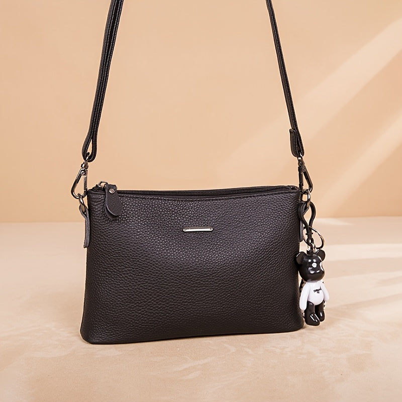 El elegante bolso bandolera de piel minimalista de Elena